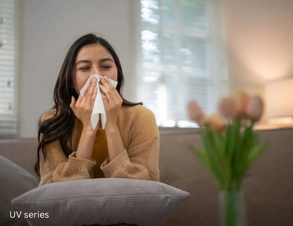A woman blowing her nose because of issues with dirty air from the HVAC